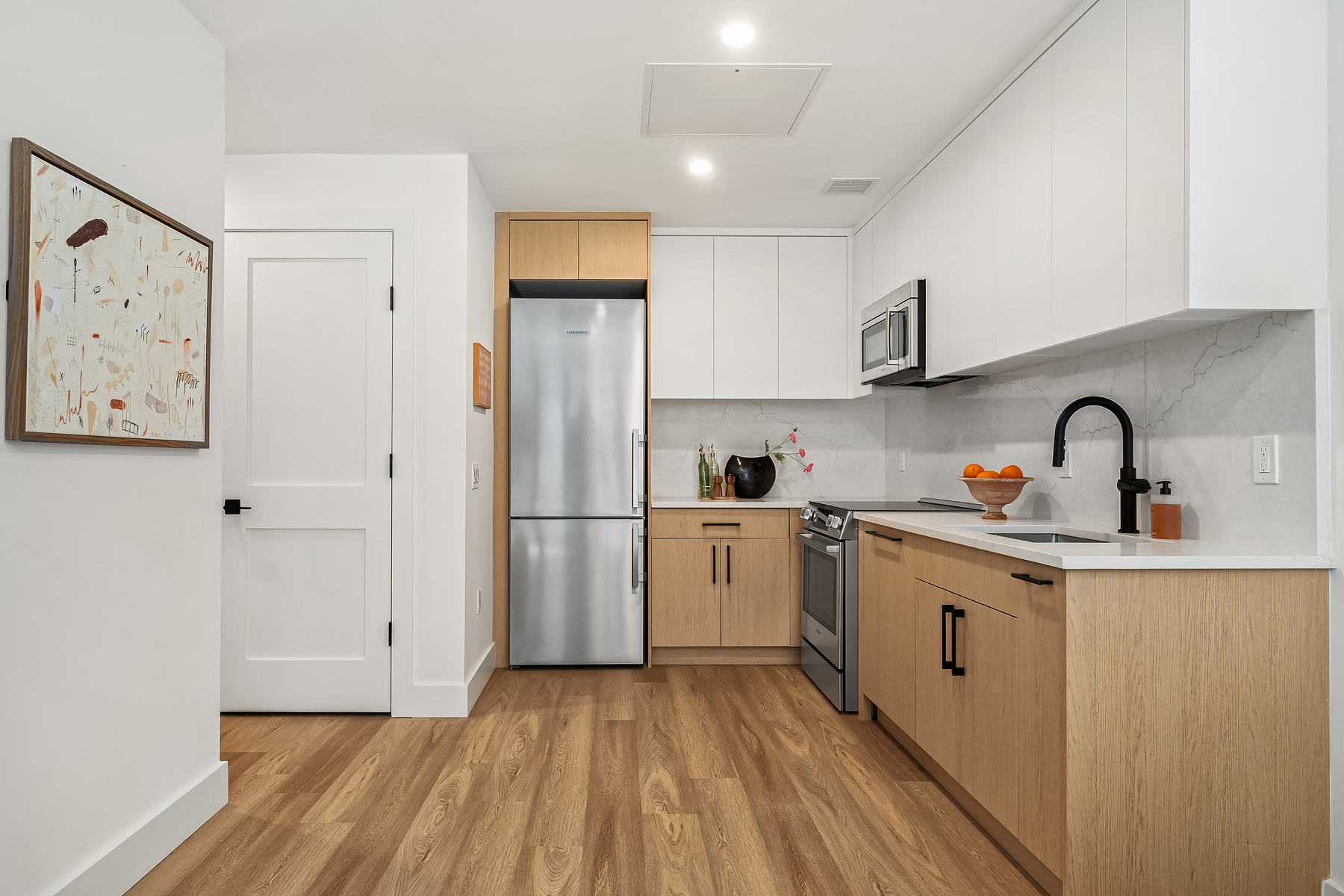 Custom kitchen with quartz counters and Bosch appliances